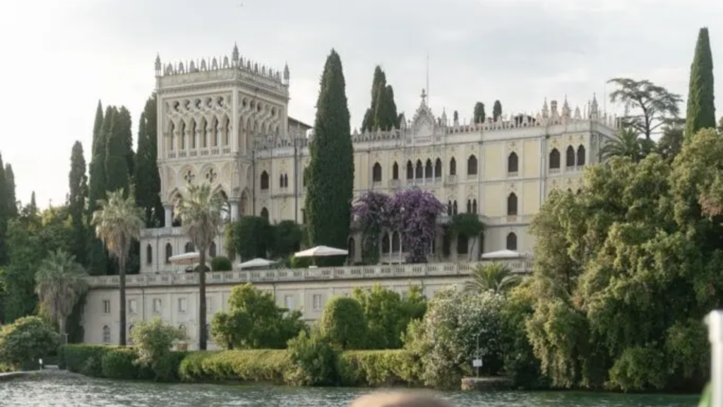 A professional wedding photographer capturing a romantic couple during the golden hour at a luxury villa in Lake Garda, Italy. This visual guide by Bild-Hochzeit provides expert tips on choosing the best destination wedding photographer in Malcesine and Sirmione.